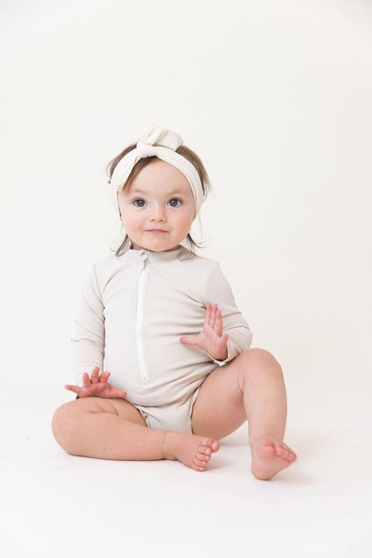 Sahara Ribbed One Piece Zip Up in Cream